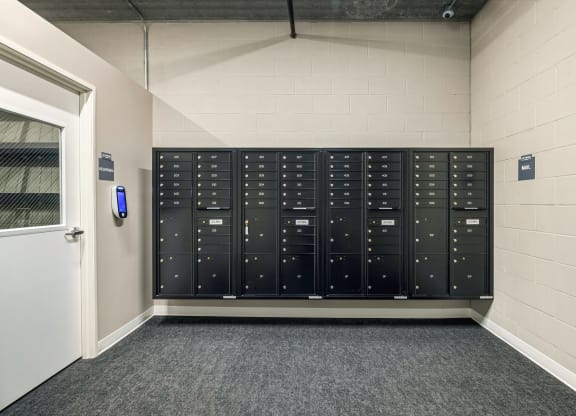 a view of the lockers in a room with a door at The Standard on 32nd, West Fargo, ND, 58078