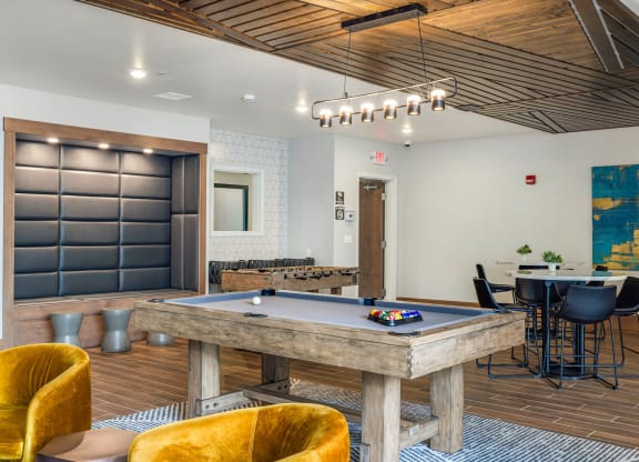 a game room with a pool table and a barat Northern Lights a Lifestyle-Driven Community, West Fargo, 58078