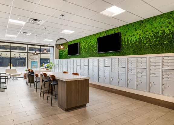 a locker room with lockers and chairs and plants on the wallat Northern Lights a Lifestyle-Driven Community, West Fargo, North Dakota