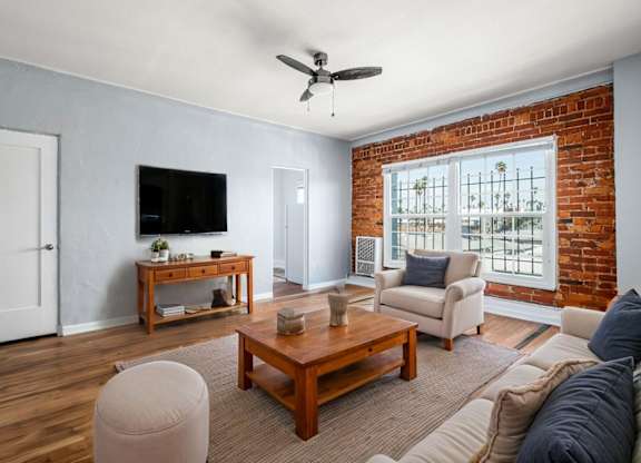 Living Room With TV at Normandie Summit Apartments, Los Angeles, CA