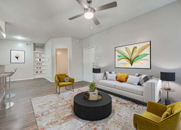 a living room with a couch and a ceiling fan at Foxborough Apartments, Irving, TX, Texas, 75061