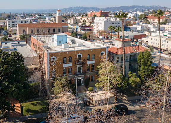 A cityscape with a prominent building in the foreground at Kenmore Park Apartments, Los Angeles, California