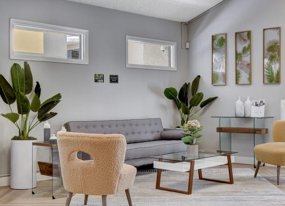 a living room with a gray couch and two yellow chairs at Summer Meadows, Las Vegas, Nevada