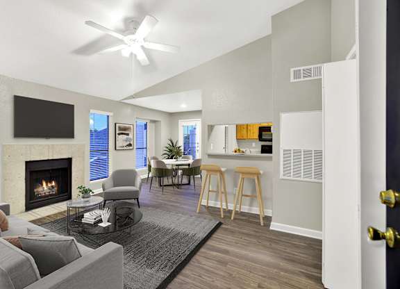 A modern living room with a fireplace and a flat screen TV. at Seacrest Apartments, Garland