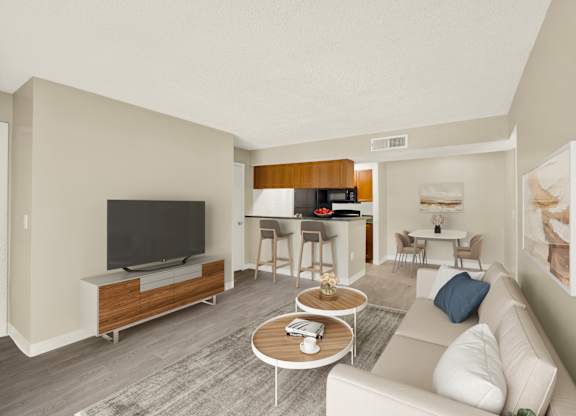 A living room with a white couch and a television.