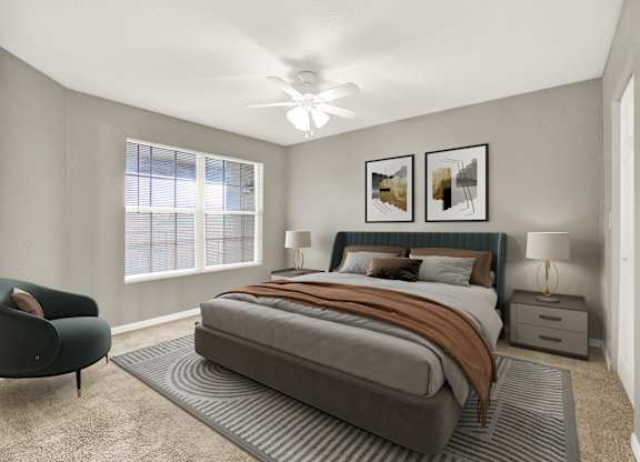 A bedroom with a large bed and a chair.