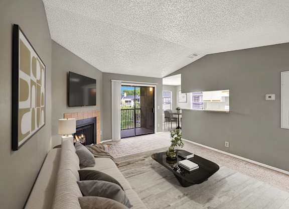 A living room with a fireplace and a couch.