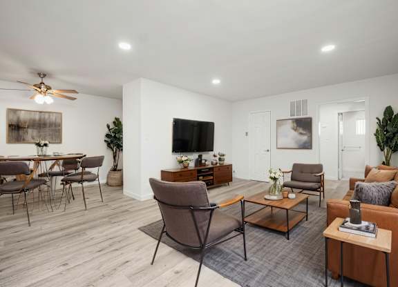 A living room with a brown chair in the center.
