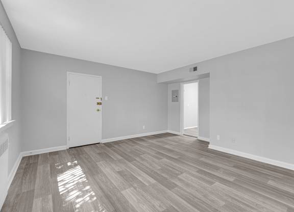 a bedroom with hardwood floors at Hampton Gardens, Saint Louis, Missouri