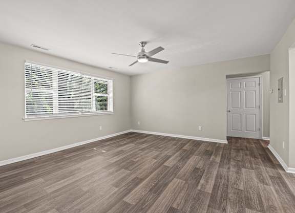 a bedroom with hardwood floors and a ceiling fan at Hampton Gardens, Saint Louis, 63139