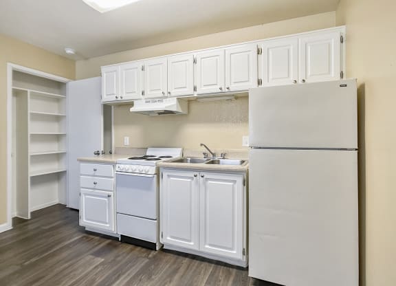 Kitchen with white cabinets at Valencia Park, Phoenix, AZ