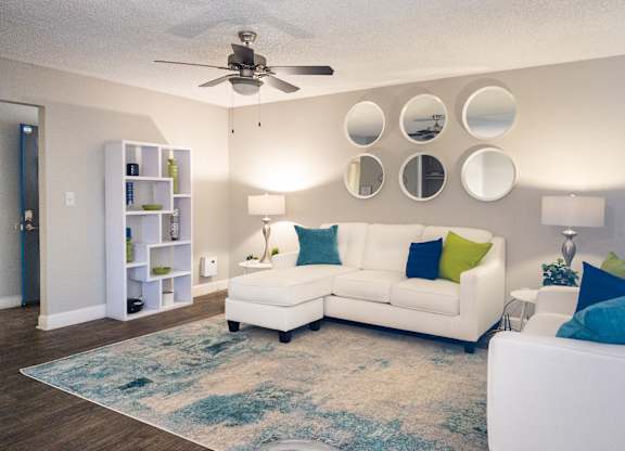 a living room with a white couch and a ceiling fan at Granite Bay, Phoenix, Arizona, 85023