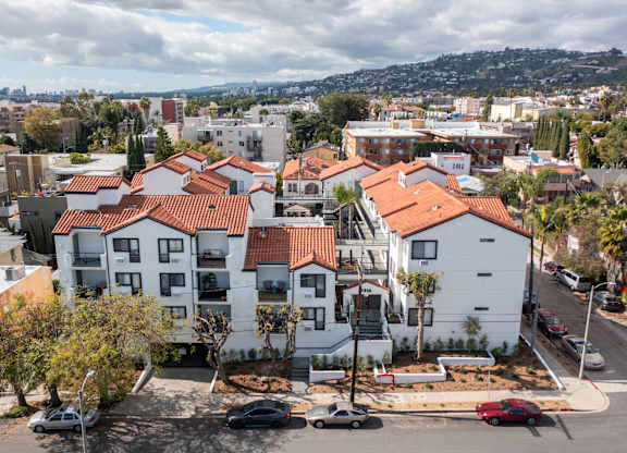 an aerial view of a row of houses in a city