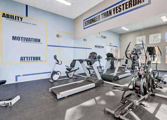 A gym with a wall that says