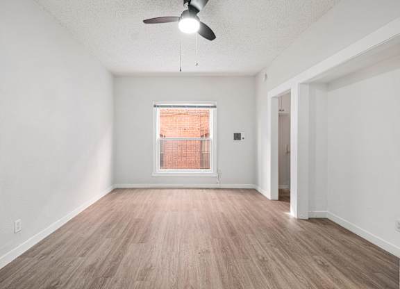 A room with a ceiling fan and a window at Hillstone Flats Apartments, Los Angeles, 90004