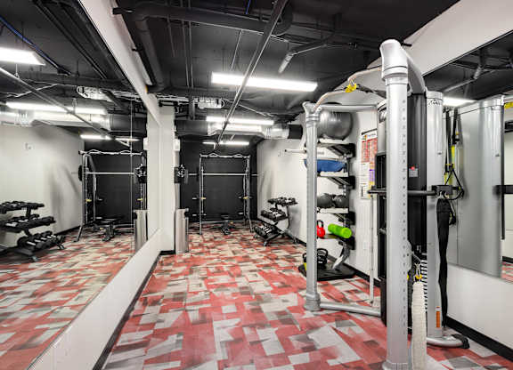 A gym with a red and white checkered floor.