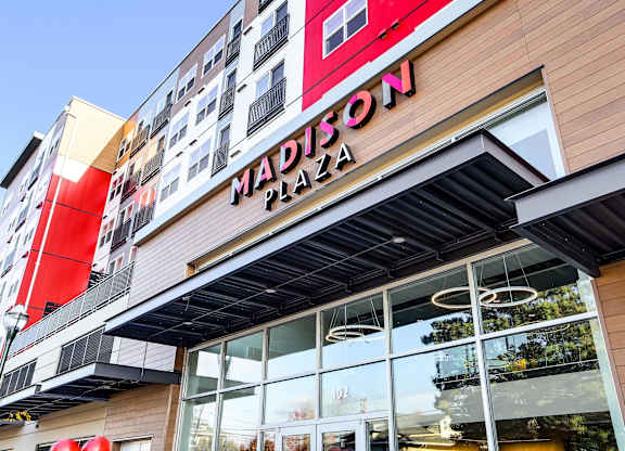 The exterior of the Madison Plaza building with a clear blue sky in the background.