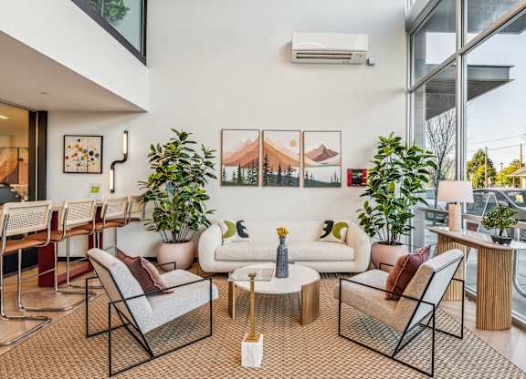 A living room with a white couch and a coffee table.
