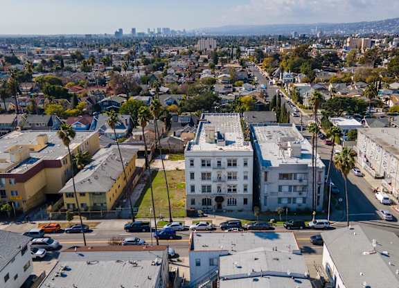 A cityscape with buildings and cars at Normandie Summit Apartments, Los Angeles, 90004