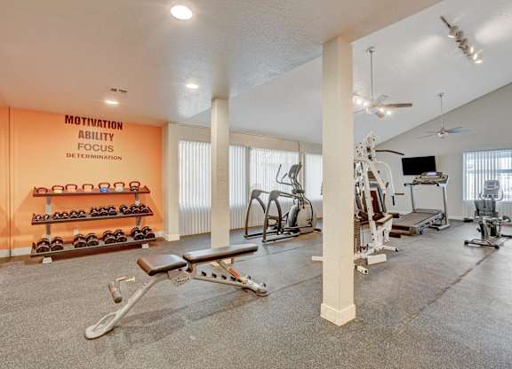 A gym with a wall that says