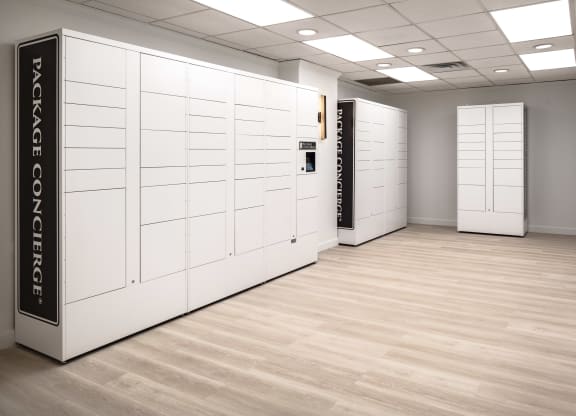 a large room with white lockers and a wooden floor at Vision on Lombard, Baltimore, MD 21201