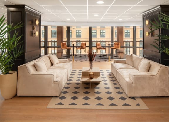 a living room with couches and a coffee table at Vision on Lombard, Baltimore, MD 21201