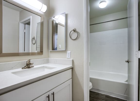 a bathroom with a sink and a bathtub at Valencia Park, Phoenix, AZ, 85008