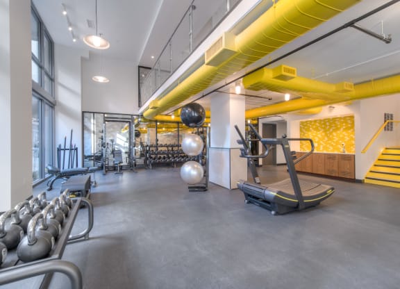 Gym space with treadmill and free weights