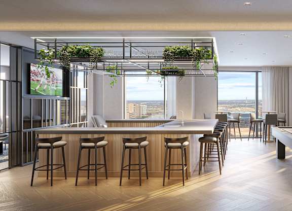 A modern bar with a pool table and a view of the city.