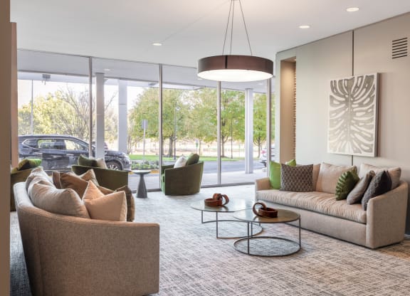 a living room with couches and chairs and a table