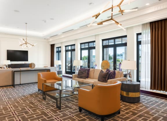 a living room filled with furniture and a large window