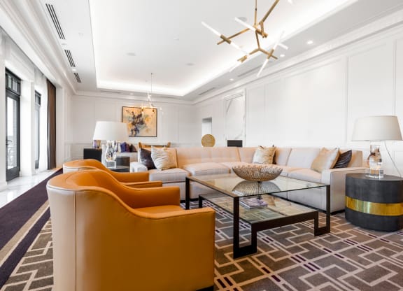 a living room filled with furniture and a large window