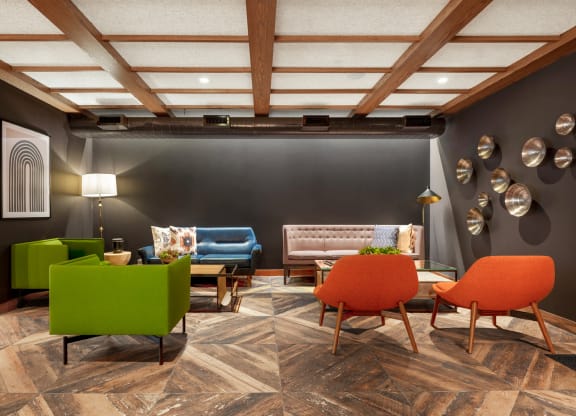 a lobby with chairs and couches and a table