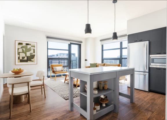 a kitchen and living room in a 555 waverly unit