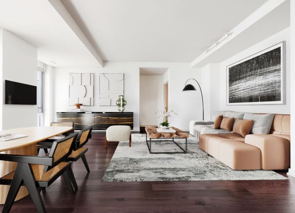a living room with white walls and hardwood floors
