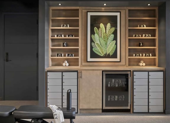 a room filled with furniture and a large painting of a plant