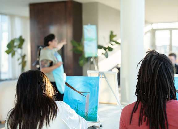 A picture of a painting class at the Spring Sip and Paint at 901W