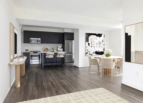 a living room and kitchen with a table and chairs at The Grace and Reva, Virginia, 22202
