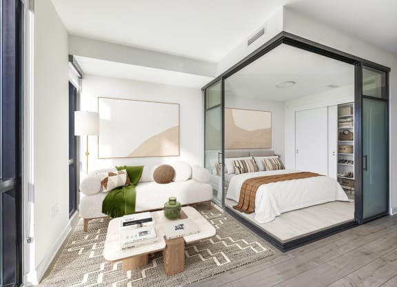 a bedroom with a large bed and a large window