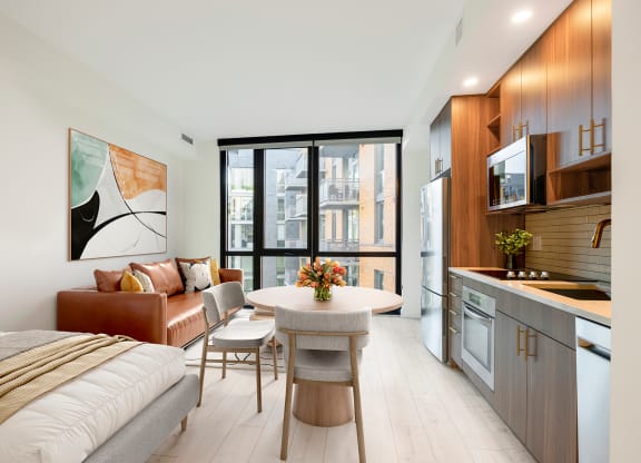 a bedroom with a bed and a table in a room