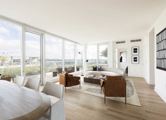 a living room filled with furniture and a large window