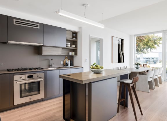 a kitchen with a large center island with a wooden countertop