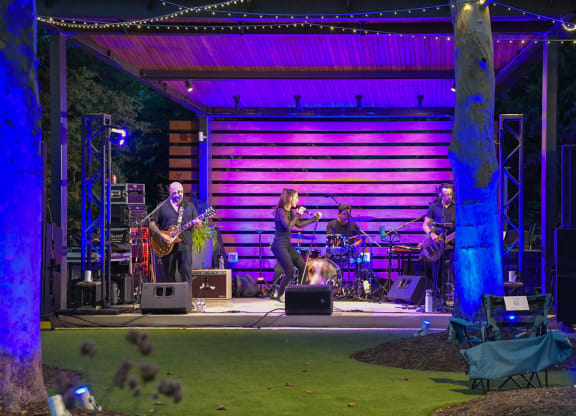 a band playing on a stage at a concert