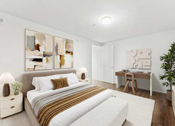 A bedroom with a large bed and a mirrored wall.