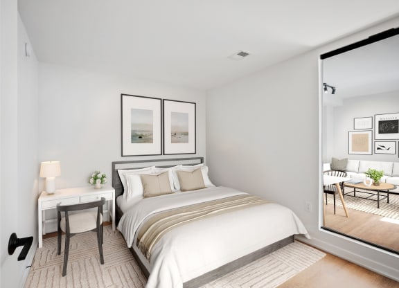 a bedroom with a large bed and a window