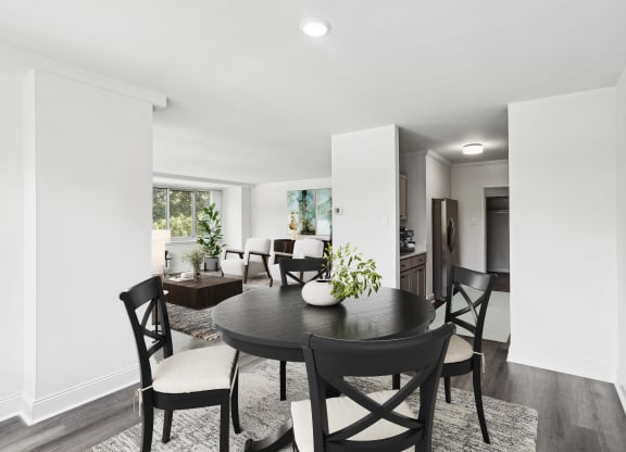 a dining room with a table and chairs
