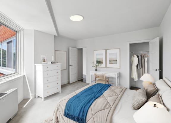 a bedroom with a bed and a dresser