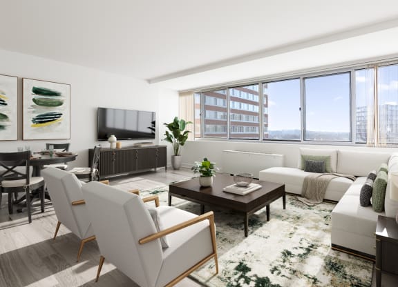 a living room with white furniture and a large window