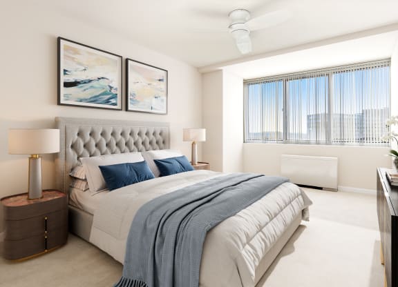 a bedroom with a bed and a large window
