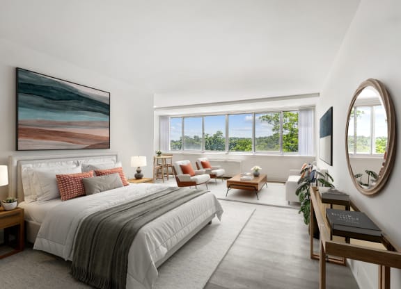 a bedroom with a bed and a large window